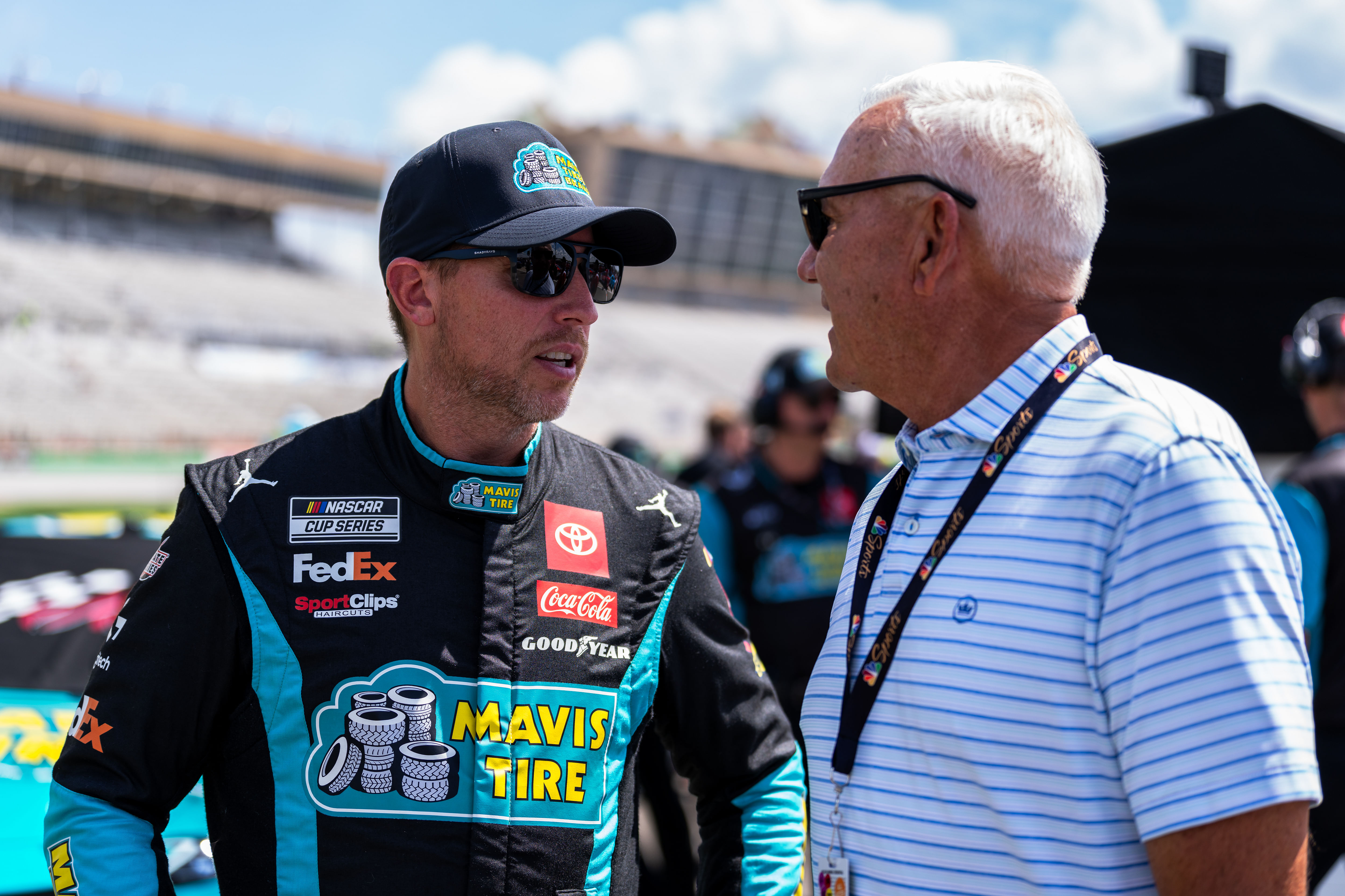 Denny Hamlin (11) speaks with an NBC correspondent before qualifying at Atlanta Motor Speedway. Mandatory Credit: Jason Allen-Imagn Images